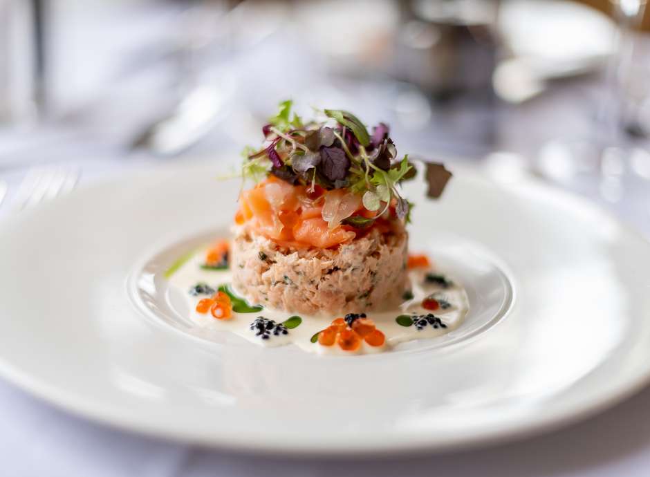 Salmon dish on a white plate in The Jubilee Restaurant